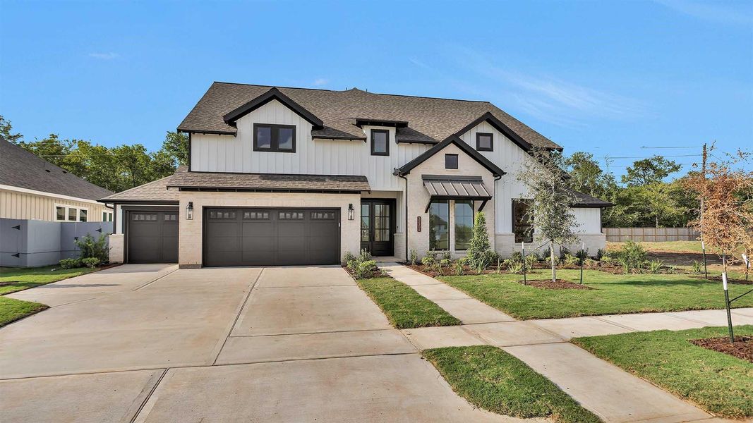 Front exterior of a new home in Fulshear Lakes 80', Fulshear, TX, highlighting curb appeal (Image 2).