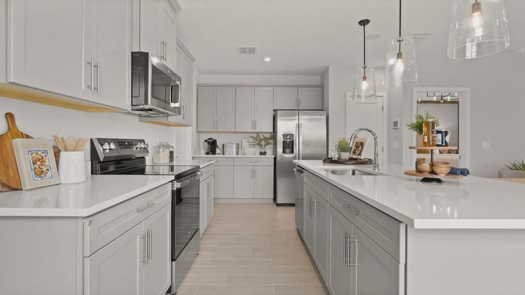 Open Concept Kitchen with spacious island at the Jupiter Model at Grasslands West in Lakeland, FL