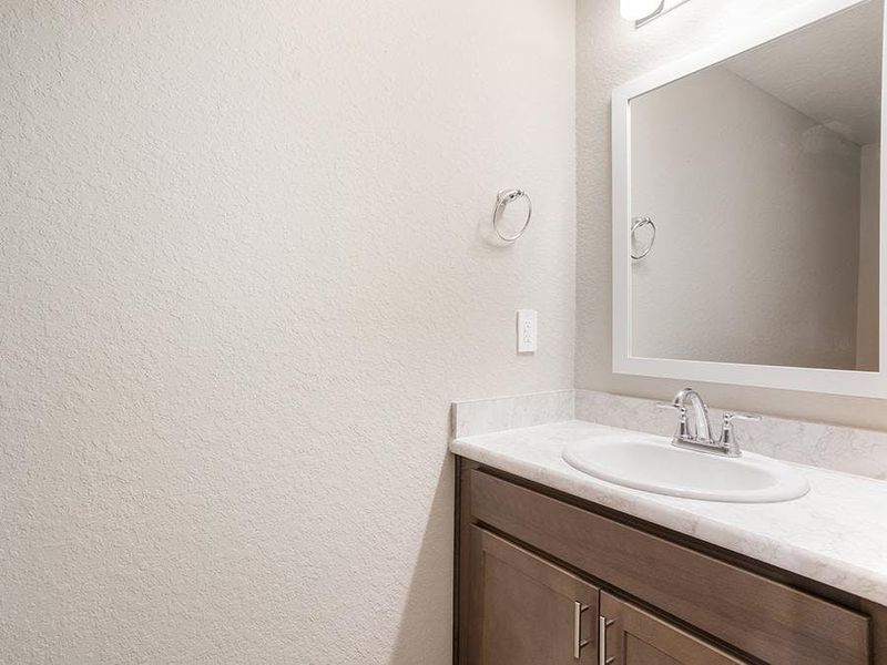 And, a convenient downstairs powder room serves your guests - Bimini townhome by Highland Homes