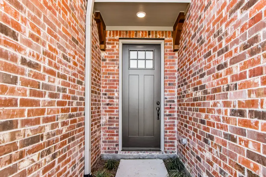 Exterior details and patio area of a home in Wildridge, Oak Point (Image 3).