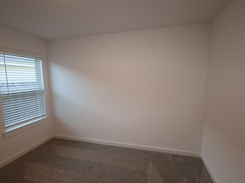 Spacious, unfurnished interior of a new home in Pinewood at Grand Texas, New Caney (Image 26).