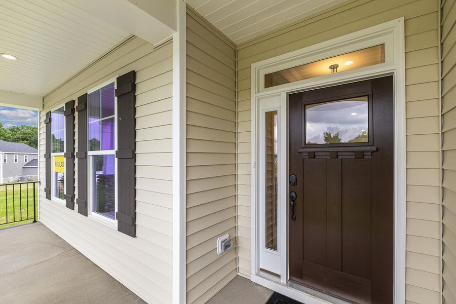Front exterior of a new home in Berea Farms, Four Oaks, NC, highlighting curb appeal (Image 24).