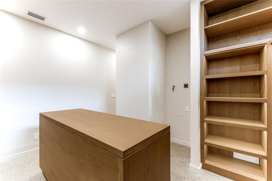 Additional storage and washer/dryer hookups in primary closet