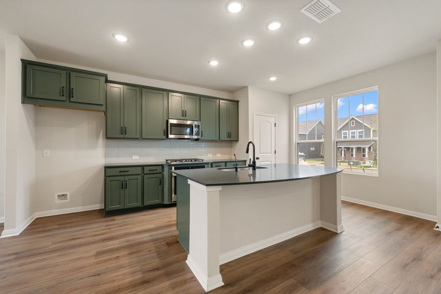 Representative furnished interior of a home built from the Robin by Ashton Woods in The Cottages at Lariat, Liberty Hill (Image 9). Representative furnished interior of a home built from the Robin by Ashton Woods in The Cottages at Lariat, Liberty Hill (Image 9).