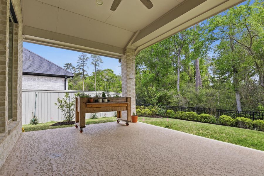 Relax in style on the expansive covered back patio, perfect for year-round outdoor entertaining.
