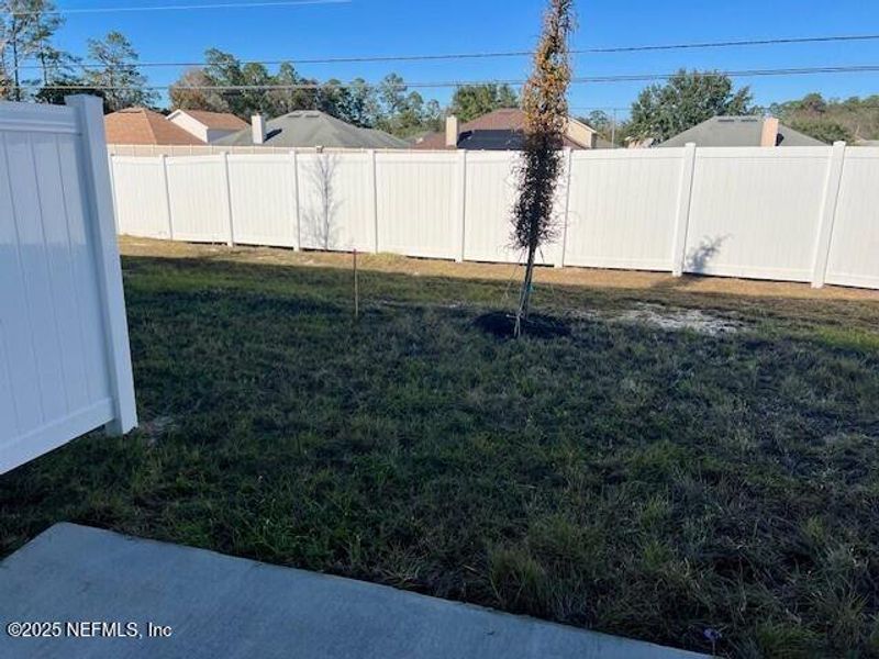 Exterior details and patio area of a home in The Landing, Middleburg (Image 2).