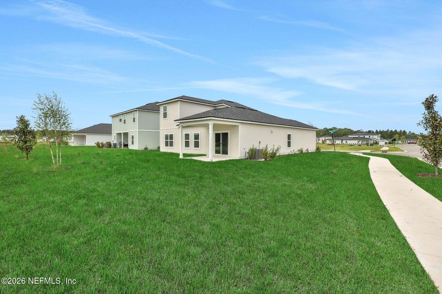 Exterior details and patio area of a home in Amberly, Green Cove Springs (Image 4).