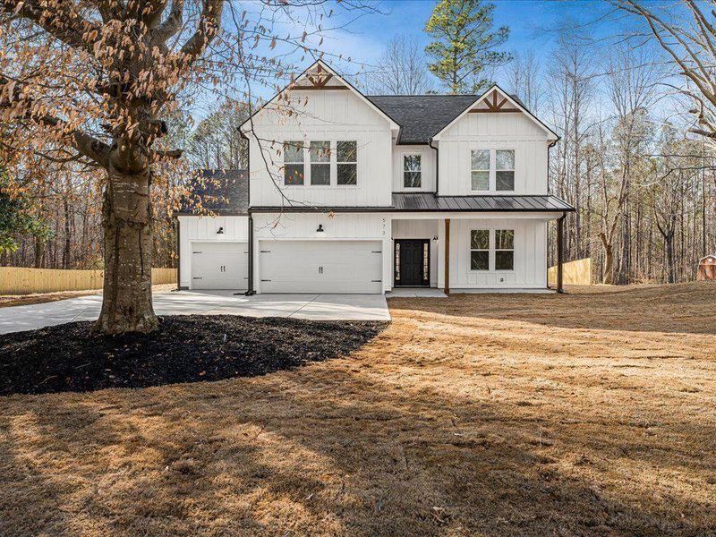 Front exterior of a new home in , Dallas, GA, highlighting curb appeal (Image 1). Front exterior of a new home in , Dallas, GA, highlighting curb appeal (Image 1).