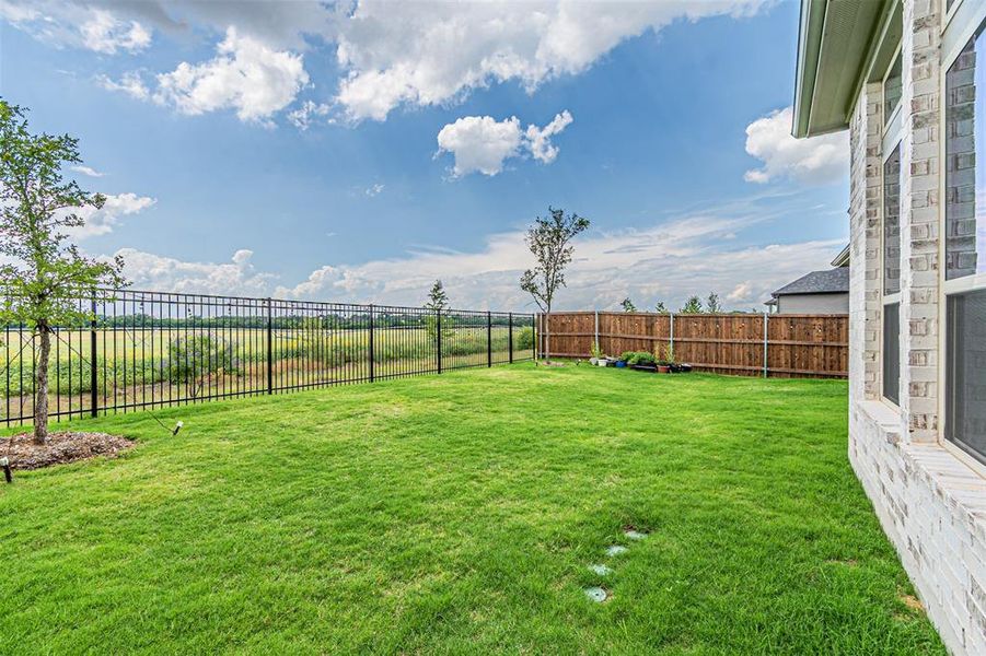 Exterior details and patio area of a home in , Aubrey (Image 25).