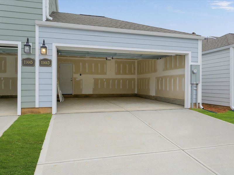 Exterior details and patio area of a home in North Creek Village - Townhomes, Huntersville (Image 3).