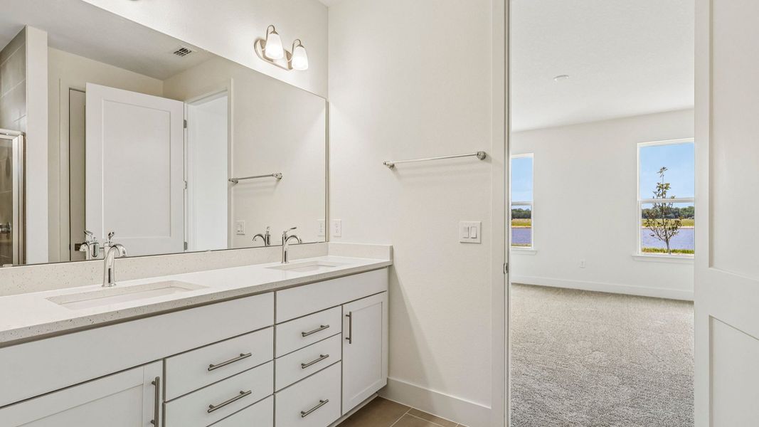 Longleaf Primary Suite Bath with Dual Vanity Sinks by DRB Homes in Trailside New Homes in Mount Dora FL Longleaf Primary Suite Bath with Dual Vanity Sinks by DRB Homes in Trailside New Homes in Mount Dora FL