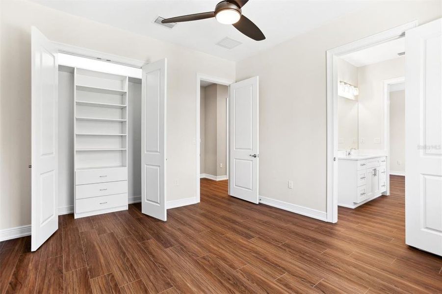 Guest Bedroom #2, featuring custom closet system.