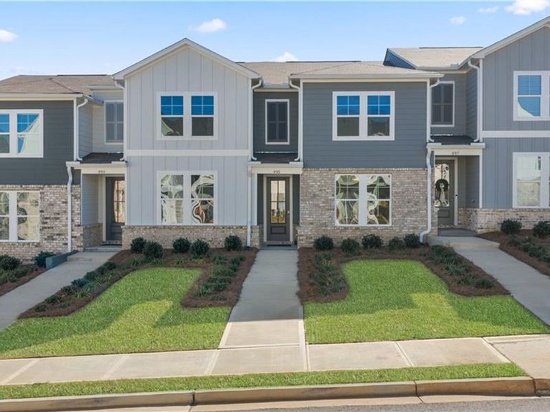Front exterior of a new home in Stegall Village, Emerson, GA, highlighting curb appeal (Image 1). Front exterior of a new home in Stegall Village, Emerson, GA, highlighting curb appeal (Image 1).
