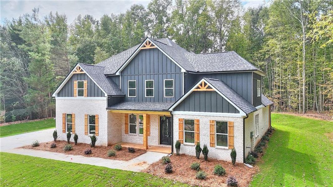 Front exterior of a new home in , Monroe, GA, highlighting curb appeal (Image 14). Front exterior of a new home in , Monroe, GA, highlighting curb appeal (Image 14).