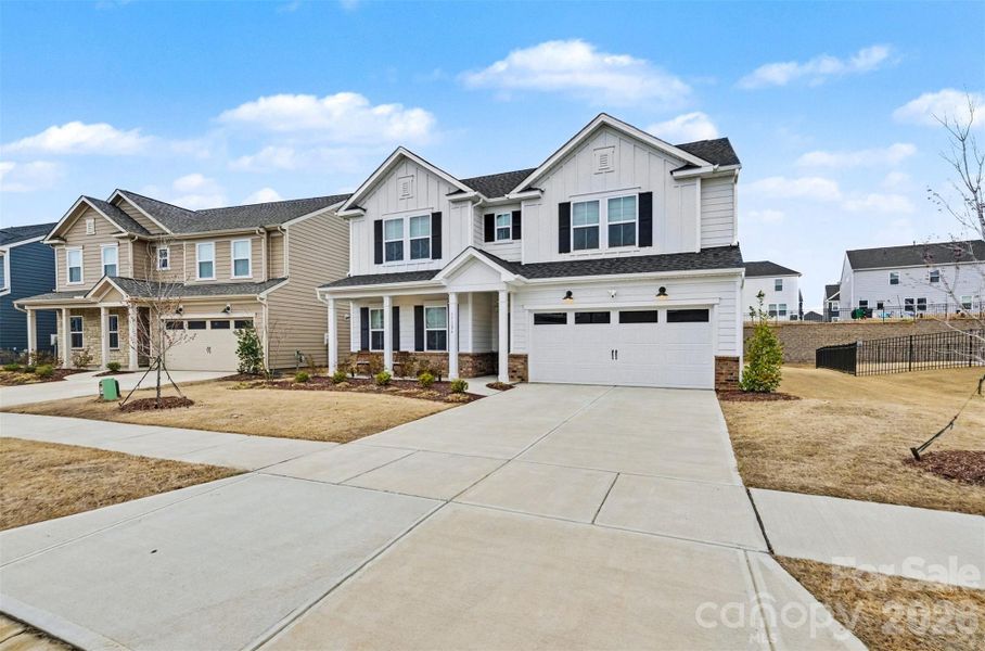 Front exterior of a new home in , Charlotte, NC, highlighting curb appeal (Image 26).