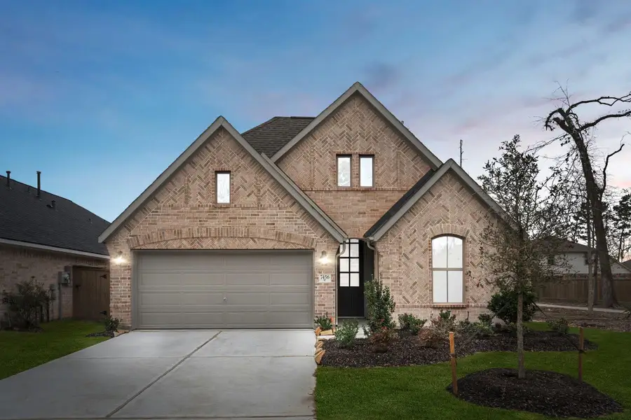 Front exterior of a new home in , Manvel, TX, highlighting curb appeal (Image 1). Front exterior of a new home in , Manvel, TX, highlighting curb appeal (Image 1).