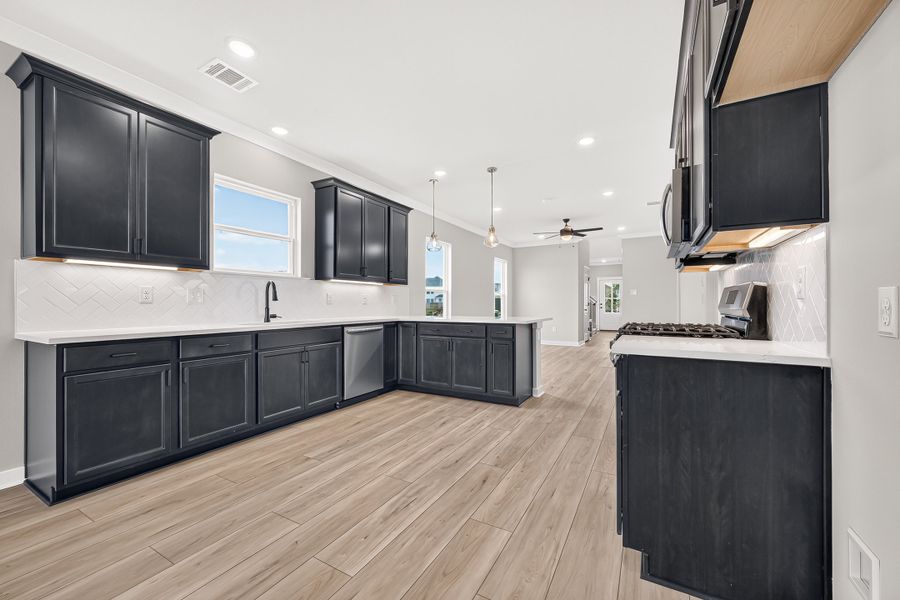 Furnished interior view inside a new home in Aldeana, Bonney (Image 12).