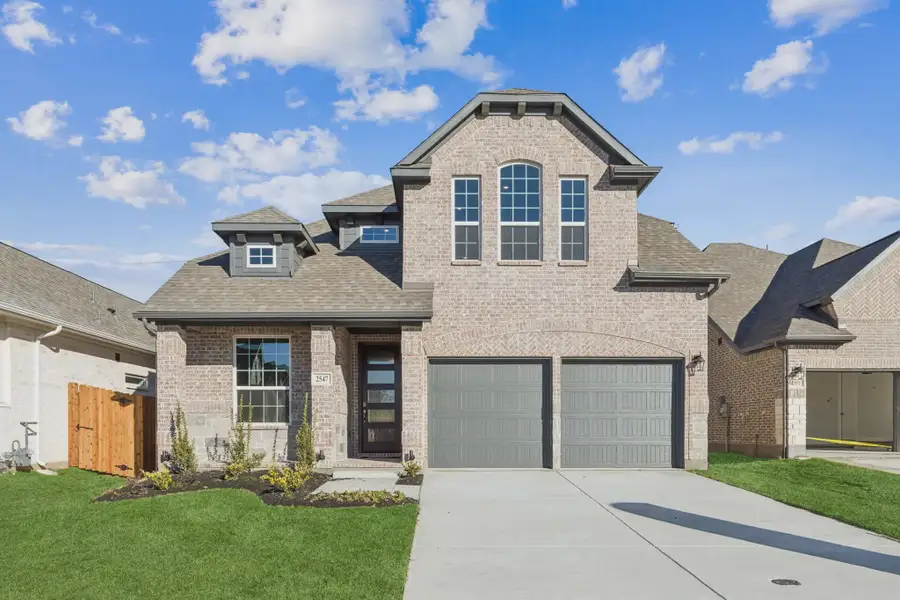 Front exterior of a new home in Summer Crest, Crowley, TX, highlighting curb appeal (Image 1). Front exterior of a new home in Summer Crest, Crowley, TX, highlighting curb appeal (Image 1).