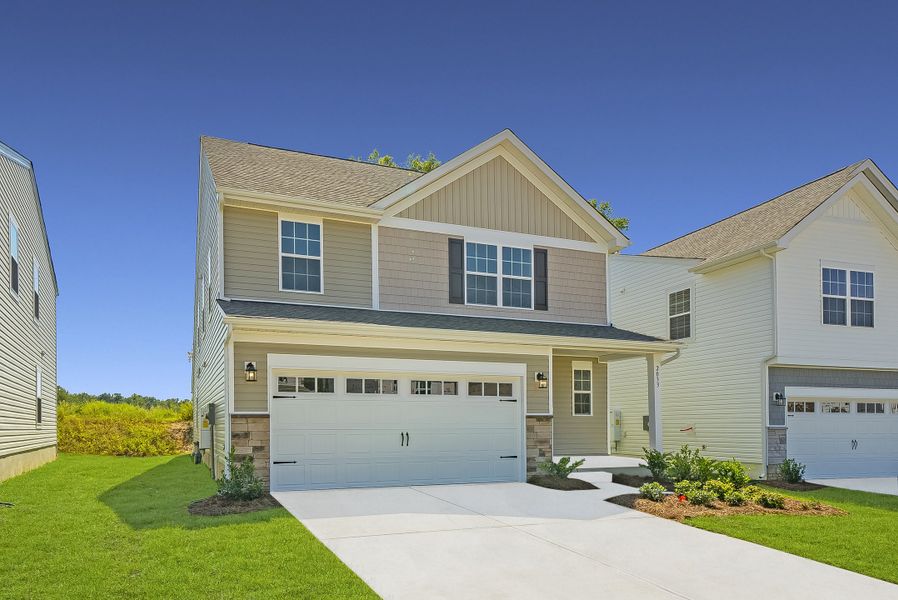 Front exterior of a new home in Oldfield: Dream, Camden, SC, highlighting curb appeal (Image 1).