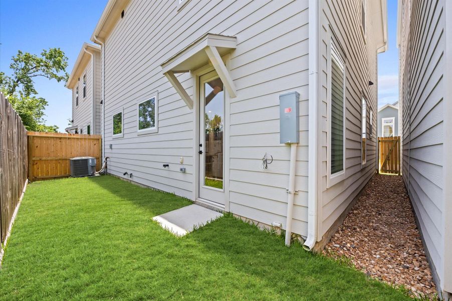 This home blends spacious outdoor living with urban elegance, featuring a generous back yard ideal for entertaining.