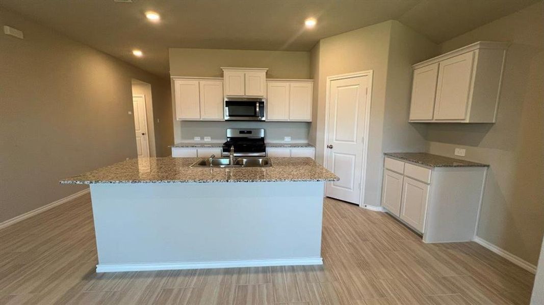 Kitchen- All Home and community information, including pricing, included features, terms, availability and amenities, are subject to change at any time without notice or obligation. All Drawings, pictures, photographs, video, square footages, floor plans, elevations, features, colors and sizes are approximate for illustration purposes only and will vary from the homes as built.