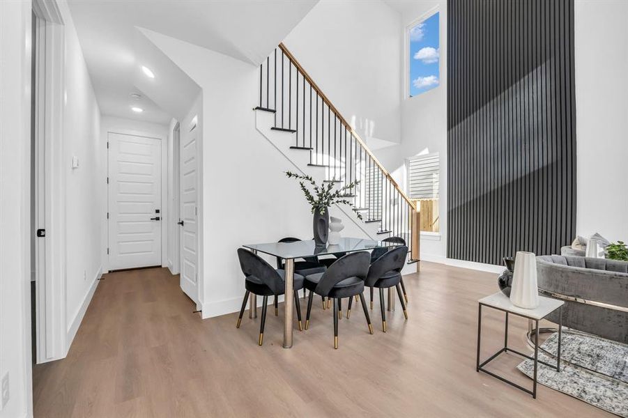 Dining room with light hardwood / wood-style flooring