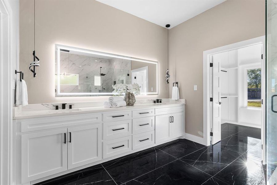 Bathroom featuring vanity and walk in shower