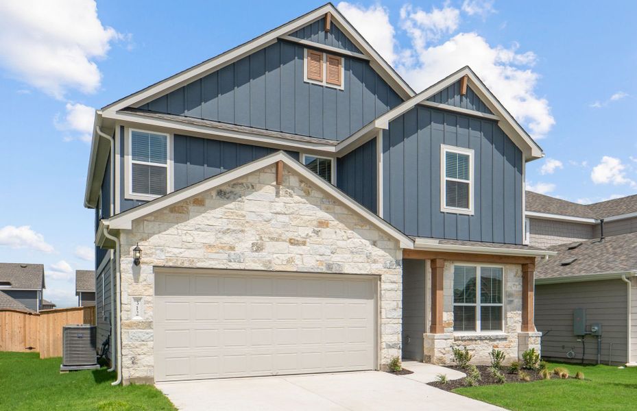 Front exterior of a new home in Patterson Ranch, Georgetown, TX, highlighting curb appeal (Image 22). Front exterior of a new home in Patterson Ranch, Georgetown, TX, highlighting curb appeal (Image 22).