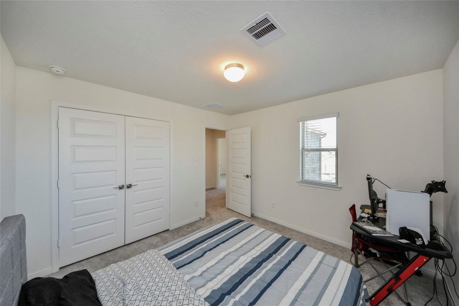 Furnished interior view inside a new home in Sunterra North, Katy (Image 28).
