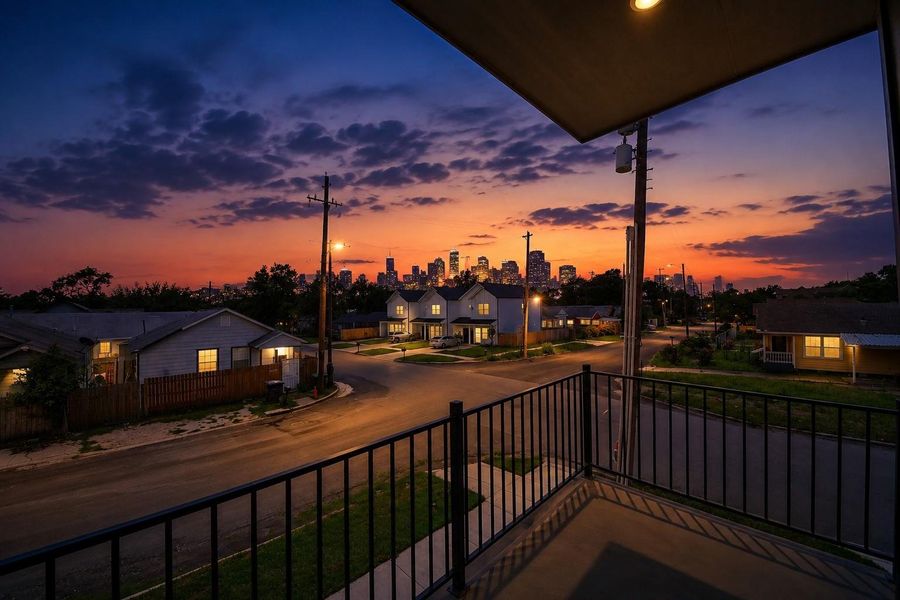 Private balcony with breathtaking Downtown Houston skyline views, creating the perfect backdrop for relaxing evenings & entertaining.