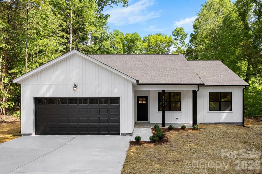 Front exterior of a new home in , Statesville, NC, highlighting curb appeal (Image 24).