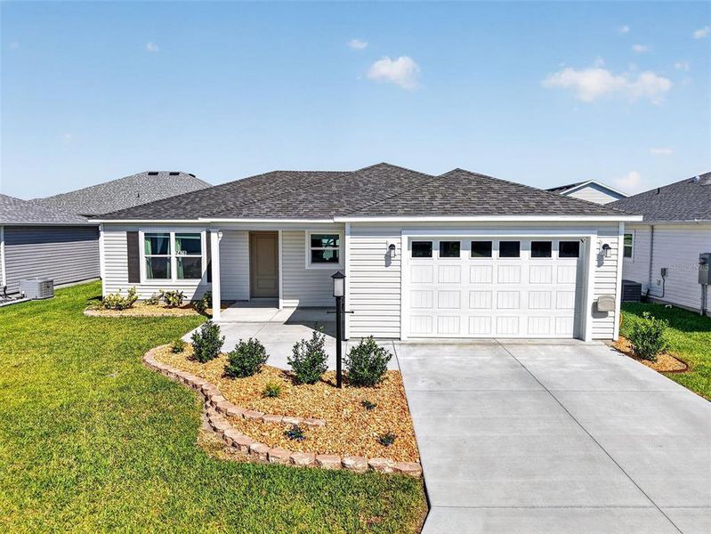 Front exterior of a new home in , The Villages, FL, highlighting curb appeal (Image 23). Front exterior of a new home in , The Villages, FL, highlighting curb appeal (Image 23).