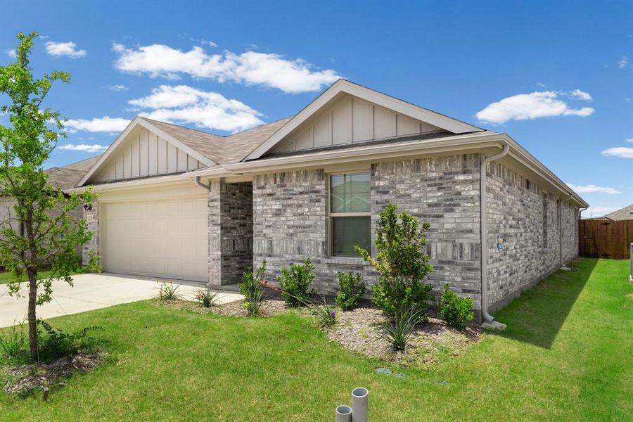 Front exterior of a new home in Stratton Place, Greenville, TX, highlighting curb appeal (Image 21). Front exterior of a new home in Stratton Place, Greenville, TX, highlighting curb appeal (Image 21).