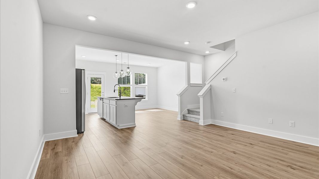 Hardwood flooring and high standards define this vibrant family room ideal for everyday living Hardwood flooring and high standards define this vibrant family room ideal for everyday living