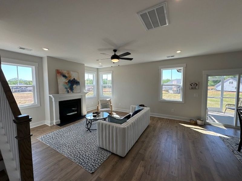 This living room features a fireplace and a seamle