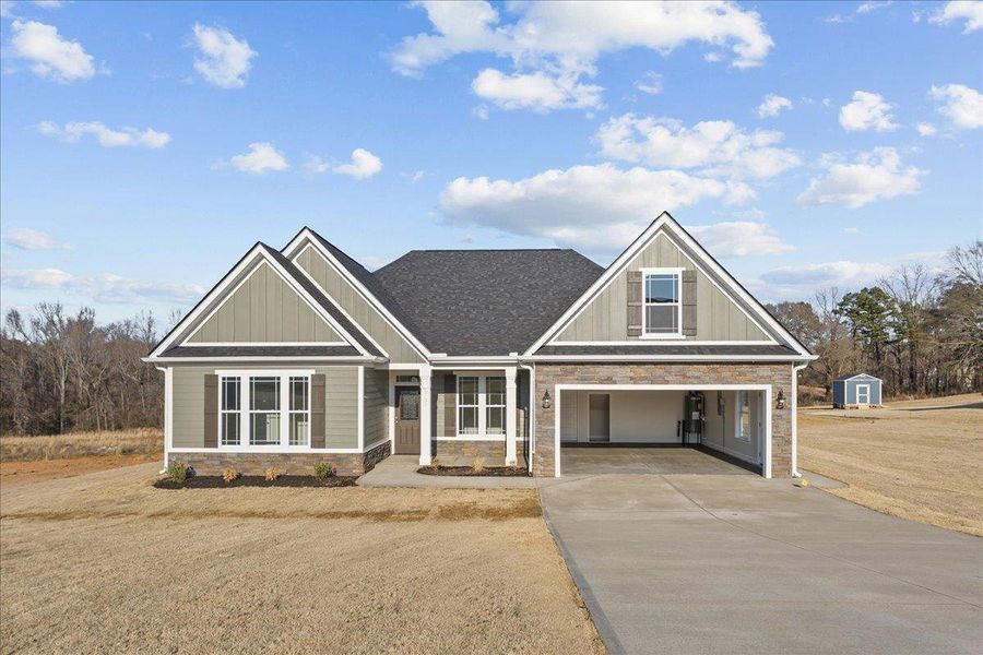 Front exterior of a new home in Messer Farms, Inman, SC, highlighting curb appeal (Image 1).
