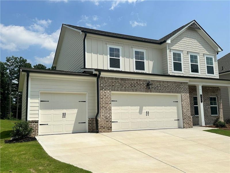 Front exterior of a new home in Summerlin, Winder, GA, highlighting curb appeal (Image 23).