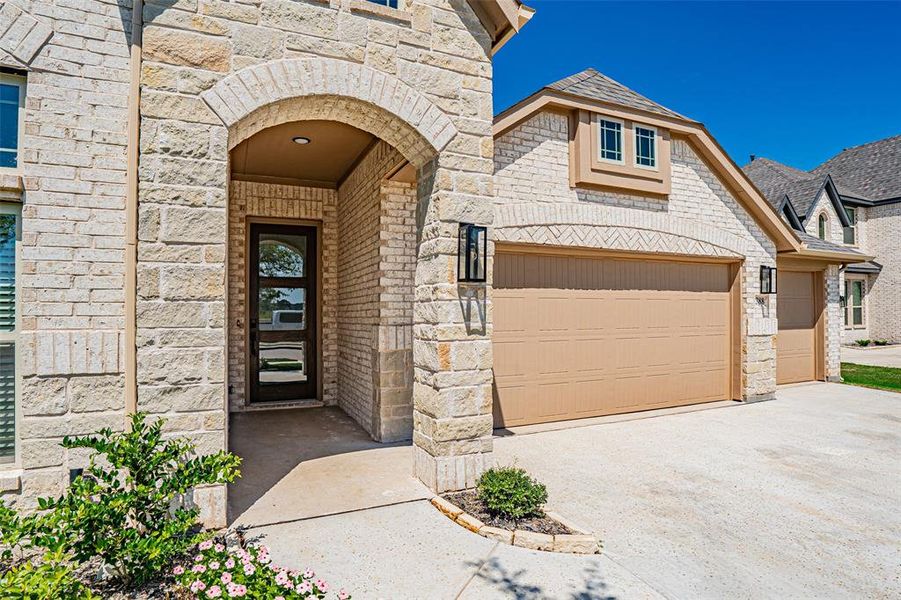 Front exterior of a new home in Abe's Landing, Granbury, TX, highlighting curb appeal (Image 23). Front exterior of a new home in Abe's Landing, Granbury, TX, highlighting curb appeal (Image 23).