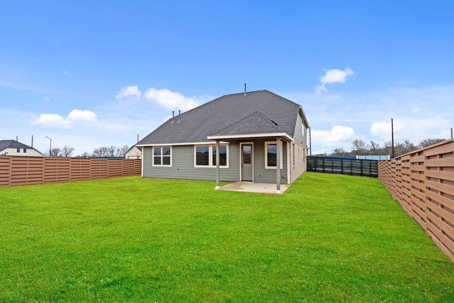 A covered patio and an oversized backyard allow for endless possibilities. A covered patio and an oversized backyard allow for endless possibilities.