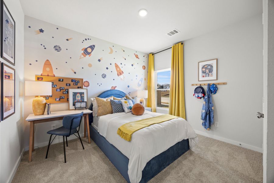 A bedroom with a bed desk and a chair. A bedroom with a bed desk and a chair.