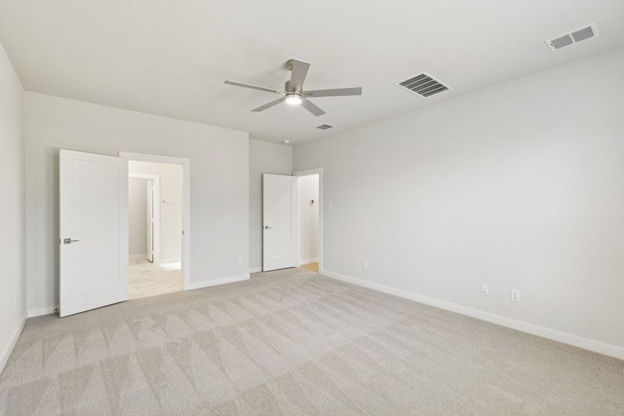 Primary Suite in the Masters home plan by Trophy Signature Homes – REPRESENTATIVE PHOTO