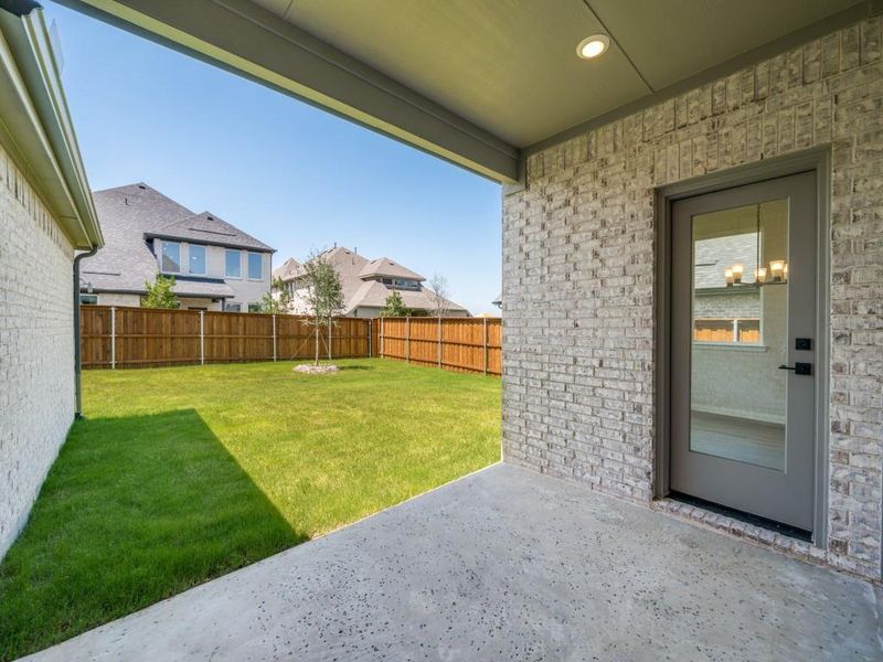 Dining al fresco is in your future on this wonderful covered back patio!