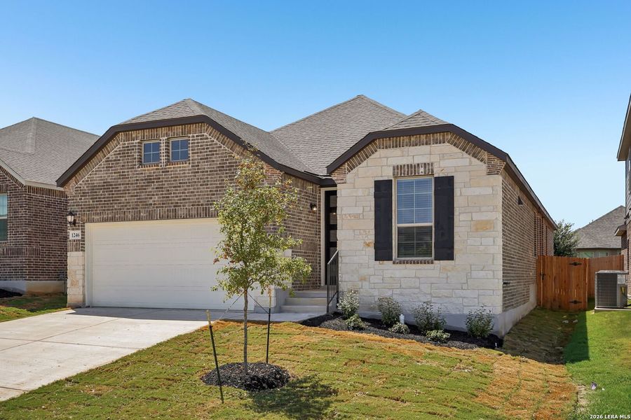 Front exterior of a new home in Arcadia Ridge - Premier Series, San Antonio, TX, highlighting curb appeal (Image 2). Front exterior of a new home in Arcadia Ridge - Premier Series, San Antonio, TX, highlighting curb appeal (Image 2).