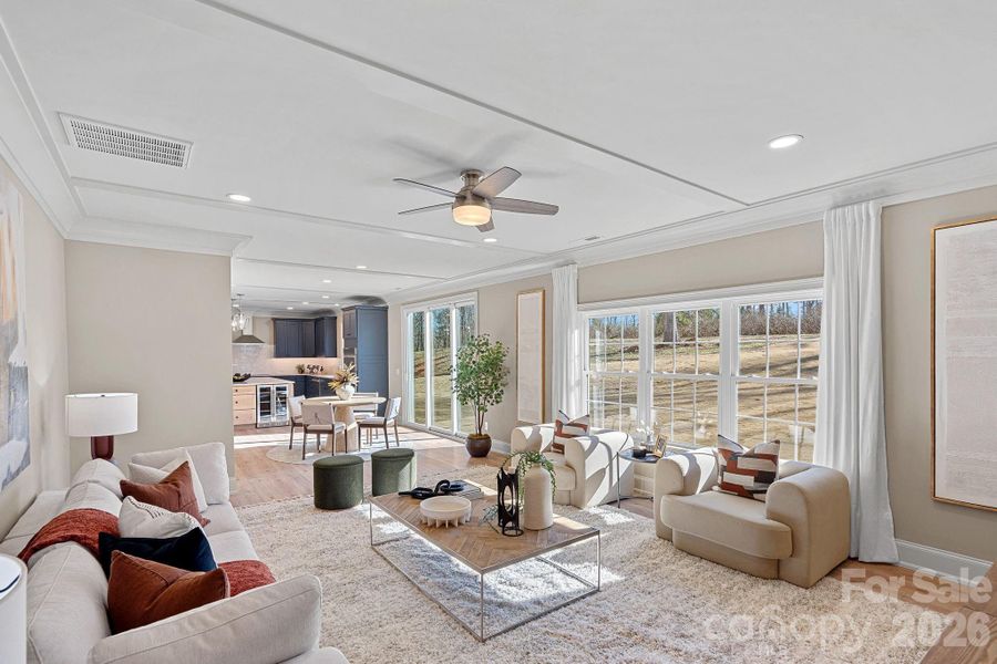 The inviting Family Room with custom ceiling details and abundant natural light, has an open, airy feel designed for everyday living.
