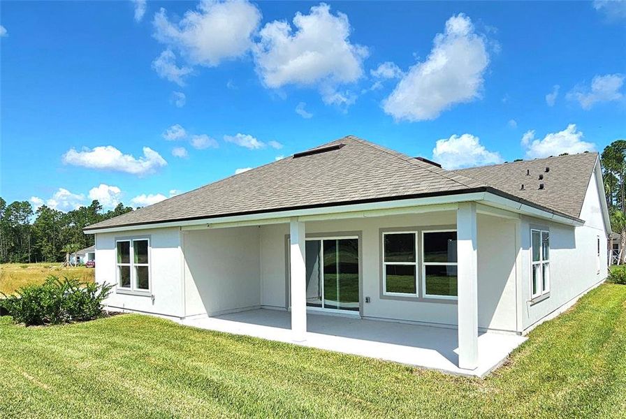 Exterior details and patio area of a home in Sawmill Branch Express, Palm Coast (Image 32).