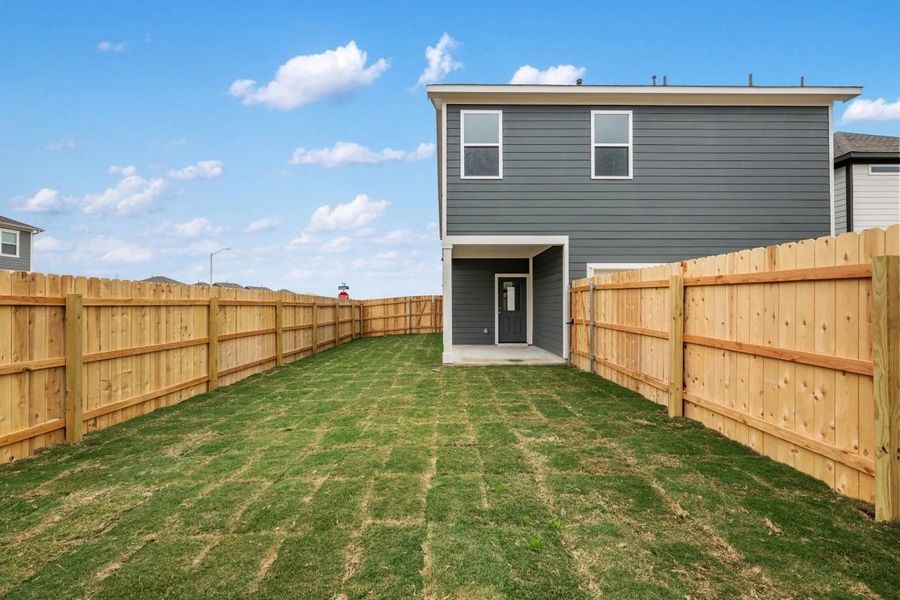 Exterior details and patio area of a home in The Cottages at Lariat, Liberty Hill (Image 30).