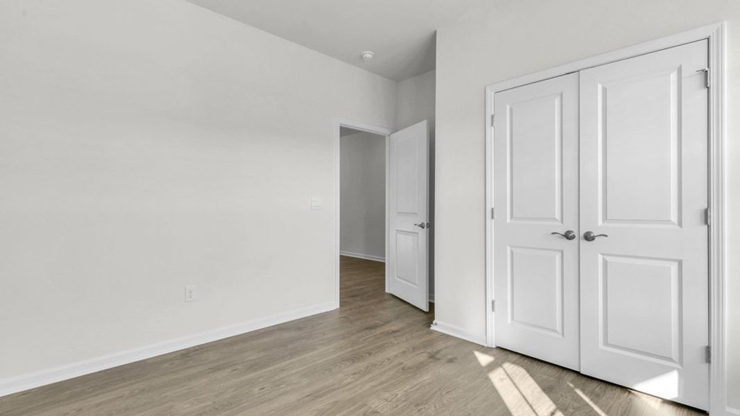 Representative unfurnished interior of a home built from the CLIFTON by D.R. Horton in The Villas at Galvins Ridge, Sanford (Image 16). Representative unfurnished interior of a home built from the CLIFTON by D.R. Horton in The Villas at Galvins Ridge, Sanford (Image 16).