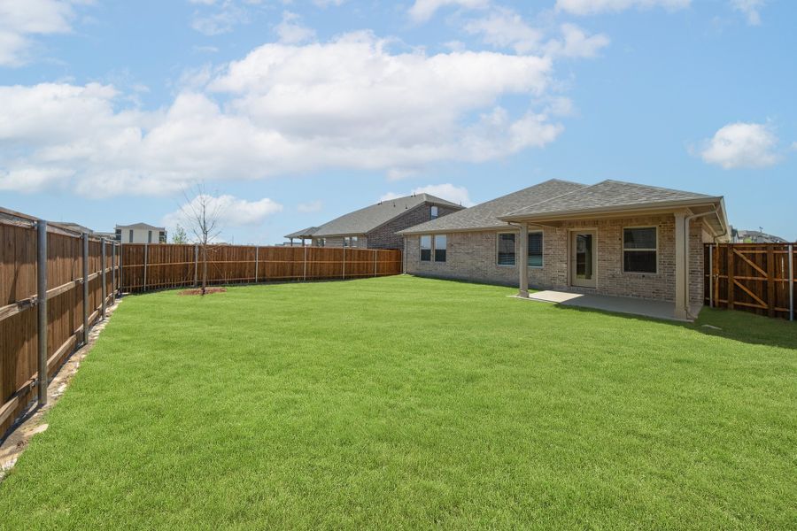 Exterior details and patio area of a home in Whitewing Trails, Princeton (Image 2).