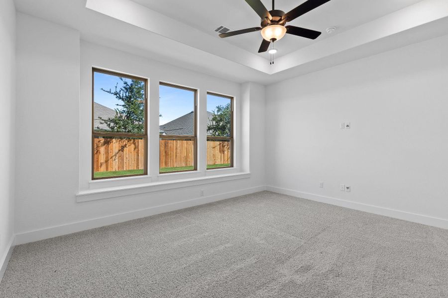 Primary Bedroom with tray ceiling Primary Bedroom with tray ceiling