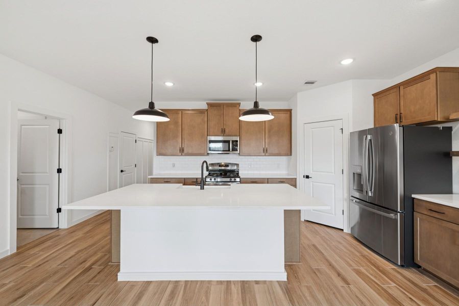 Stylish island kitchen (*Photo not of actual home and used for illustration purposes only.)